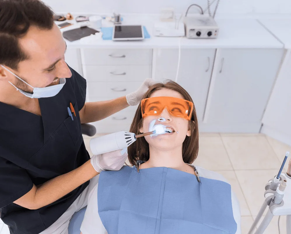 Dentist performing malocclusion treatment procedure