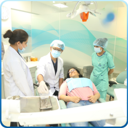 Two dentist & a nurse preparing for a implant treatment on a woman